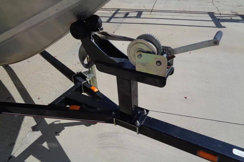 Slide: The Image of Trailer winch of a 2006 Bass Tracker PT175 boat on concrete surface. - 12
