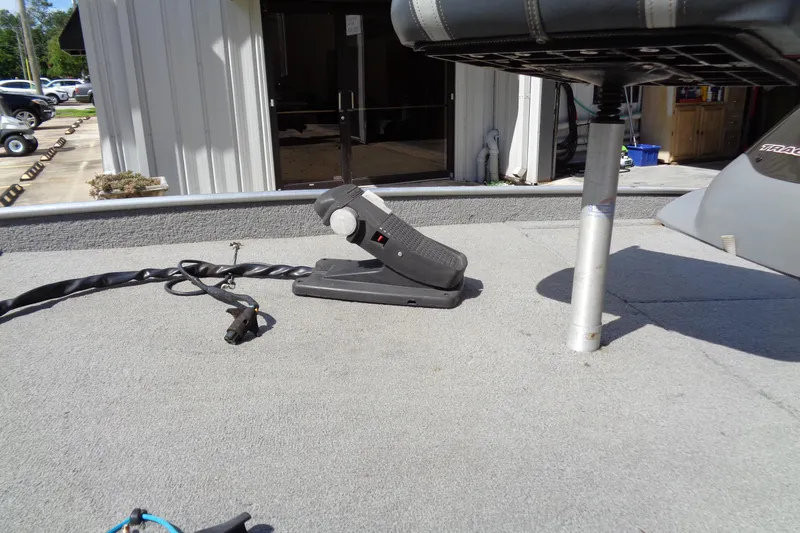 Slide: The Image of 2006 Bass Tracker PT175 boat deck with foot pedal and seat post. - 3