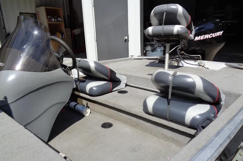 Slide: The Image of 2006 Bass Tracker PT175 boat interior with seats and Mercury engine. - 5
