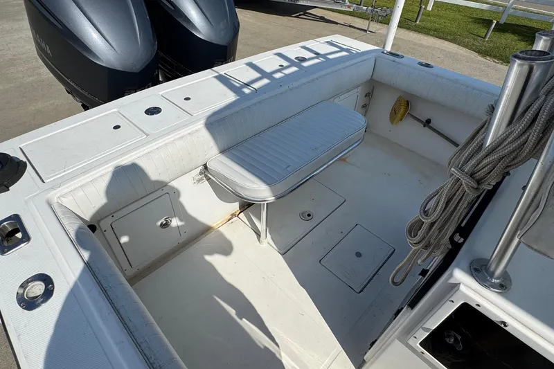 Slide: The Image of 2000 Regulator 26 Center Console boat interior with seating and storage compartments. - 22