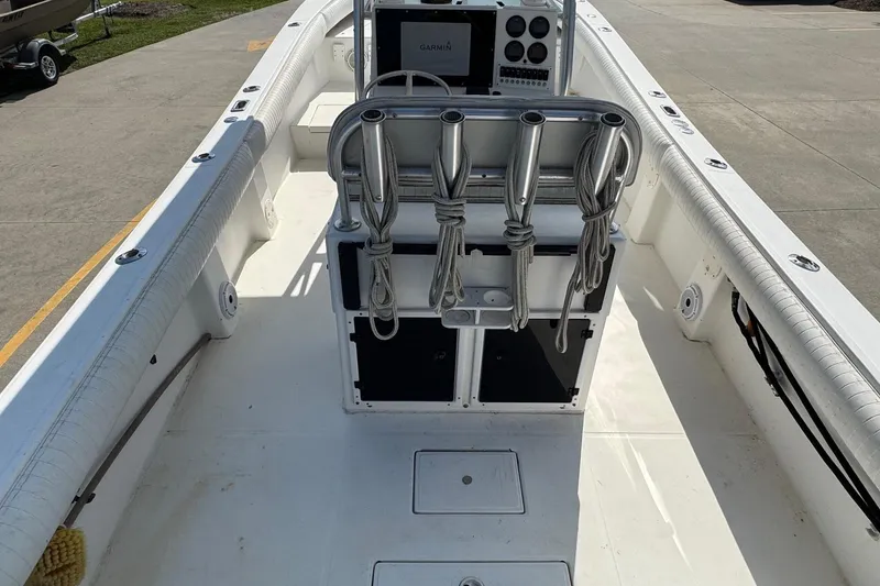 Slide: The Image of 2000 Regulator 26 Center Console boat interior with rod holders and navigation equipment. - 6