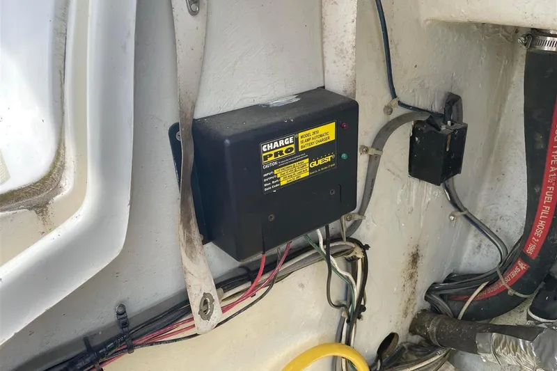 Slide: The Image of Battery charger installed in a 1986 J Boats J/28 sailboat, showing wiring and connections. - 12