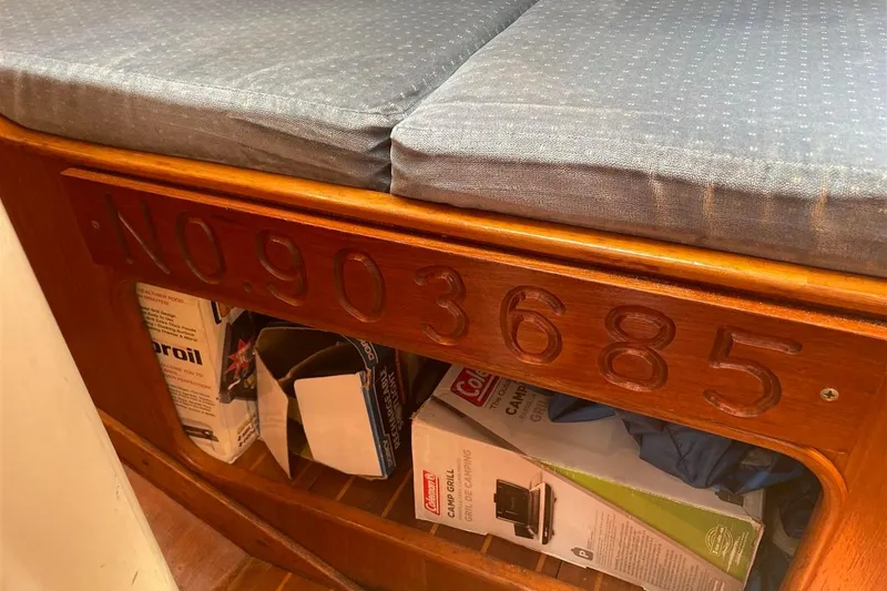 Slide: The Image of Interior of 1986 J Boats J/28 with wooden panel and storage area. - 18