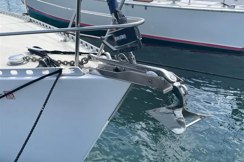 Slide: The Image of 1986 J Boats J/28 sailboat anchor and bow detail in marina setting. - 2