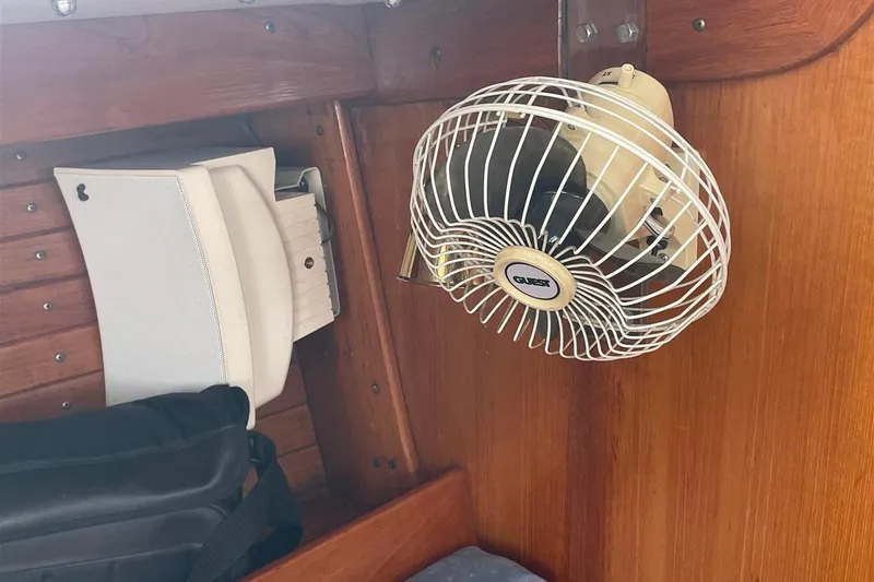 Slide: The Image of Interior of 1986 J Boats J/28 with mounted fan and wooden paneling. - 26