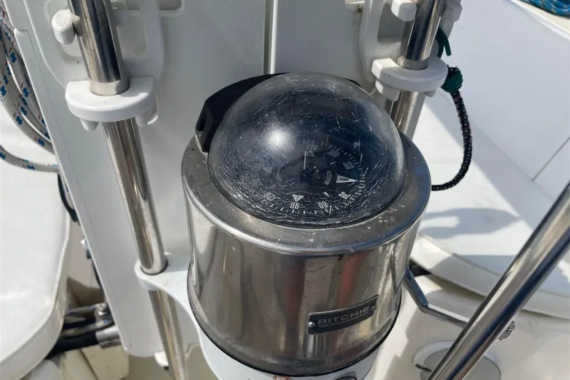 Slide: The Image of Compass on 1986 J Boats J/28 sailboat, featuring a Ritchie navigation instrument. - 9
