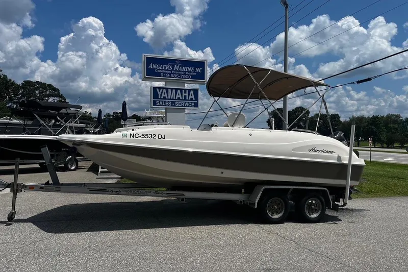 The Image of 2008 Hurricane FD202 boat on trailer at Anglers Marine NC, under cloudy sky. - 0