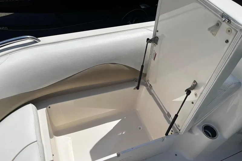 Slide: The Image of Open storage compartment on a 2008 Hurricane FD202 boat, showcasing interior space. - 14