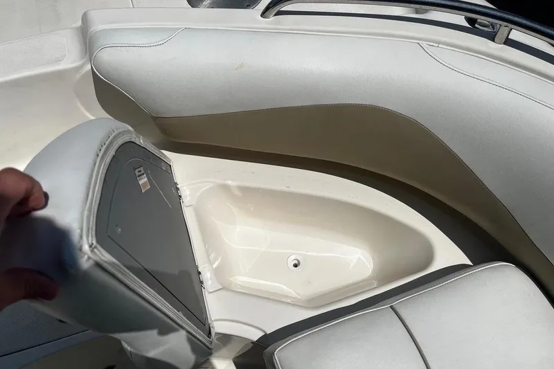Slide: The Image of Open storage compartment in 2008 Hurricane FD202 boat with cushioned seating. - 15