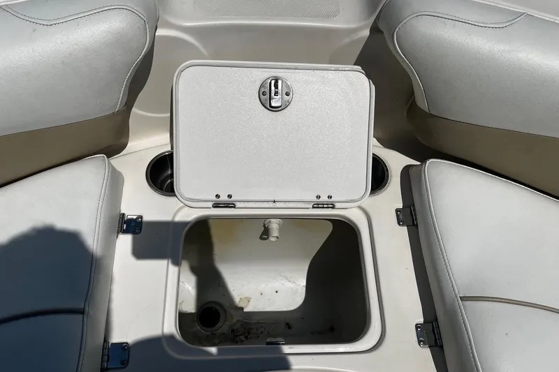 Slide: The Image of Open storage compartment on a 2008 Hurricane FD202 boat with cushioned seating. - 17
