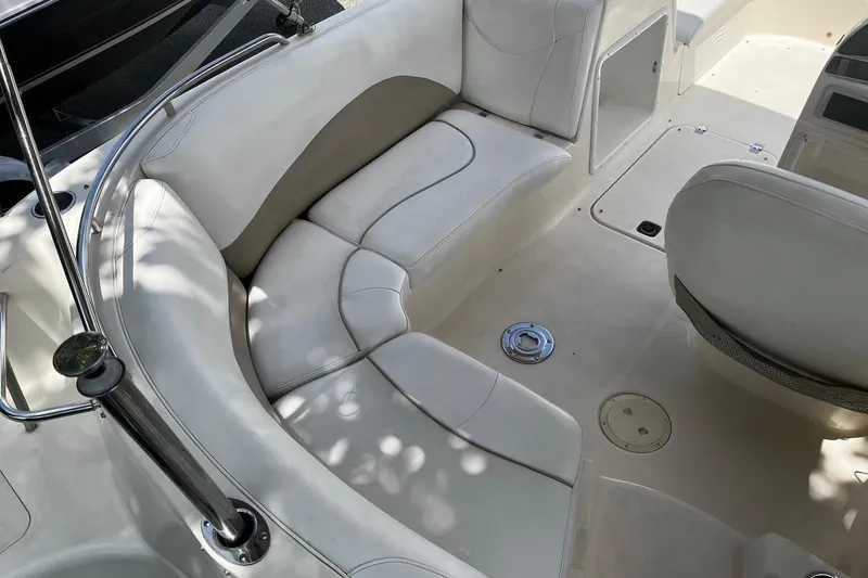 Slide: The Image of Interior of a 2008 Hurricane FD202 boat with white seating and sleek design. - 4