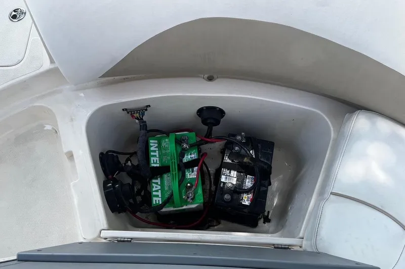 Slide: The Image of Battery compartment of a 2008 Hurricane FD202 boat, featuring Interstate batteries. - 9