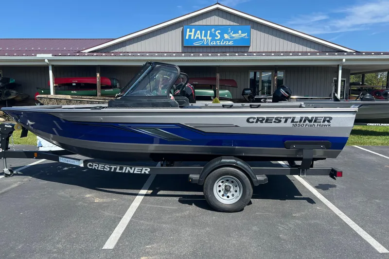 Slide: The Image of 2024 Crestliner 1850 Fish Hawk boat on trailer at Hall's Marine dealership. - 0