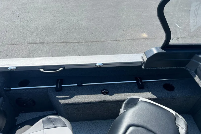 Slide: The Image of 2024 Crestliner 1850 Fish Hawk interior with seating and storage features. - 11