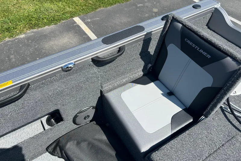Slide: The Image of 2024 Crestliner 1850 Fish Hawk boat seat with gray upholstery and sleek design. - 13