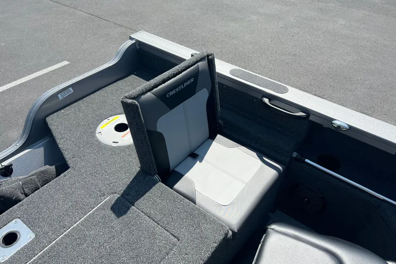 Slide: The Image of 2024 Crestliner 1850 Fish Hawk boat interior with seating and storage features. - 14