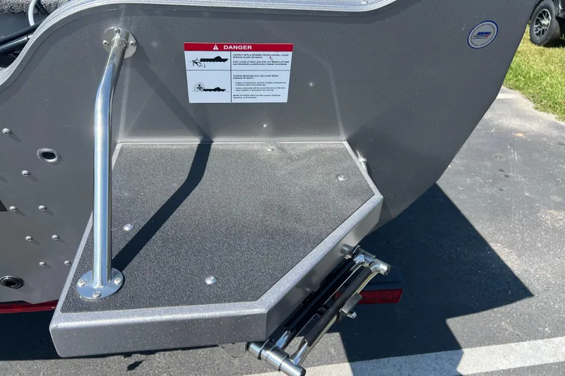 Slide: The Image of 2024 Crestliner 1850 Fish Hawk boat platform with safety warning label. - 16