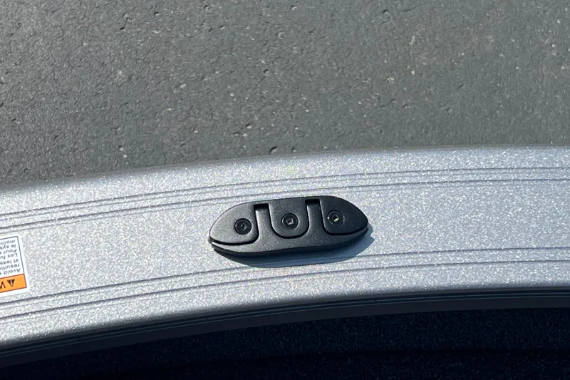 Slide: The Image of 2024 Crestliner 1850 Fish Hawk boat detail with metallic finish and latch. - 18