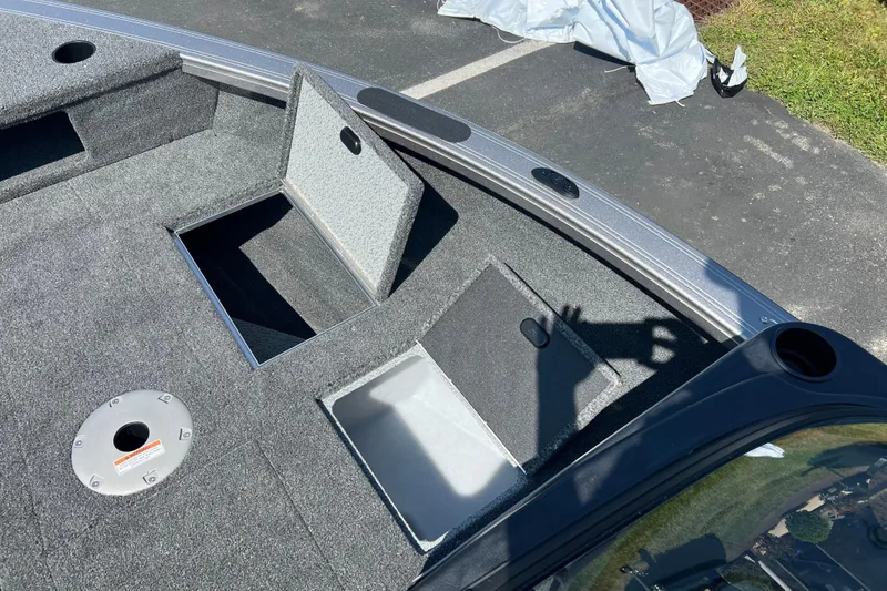 Slide: The Image of 2024 Crestliner 1850 Fish Hawk boat interior with open storage compartments. - 3