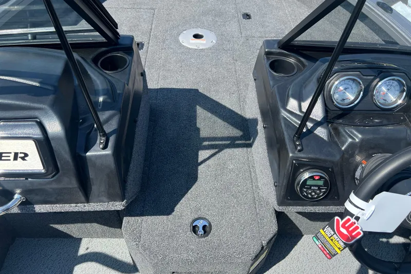 Slide: The Image of 2024 Crestliner 1850 Fish Hawk boat interior with dashboard and steering wheel. - 5