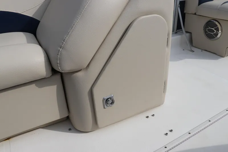 Slide: The Image of 2014 Hurricane FunDeck 226 boat interior with beige seating and speaker. - 11
