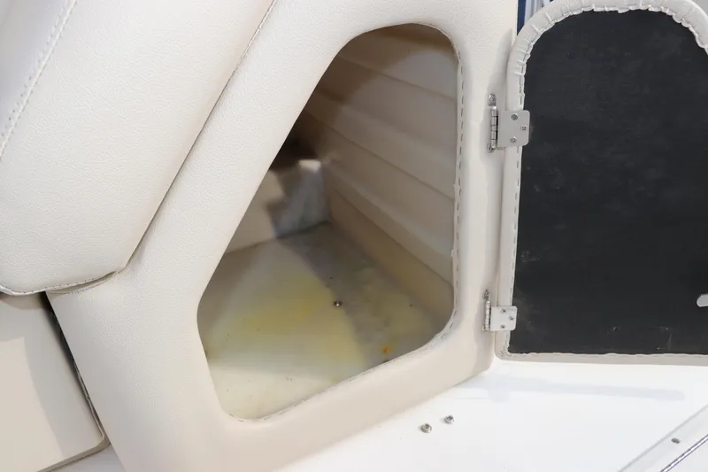 Slide: The Image of Storage compartment on a 2014 Hurricane FunDeck 226 boat, featuring white interior. - 12