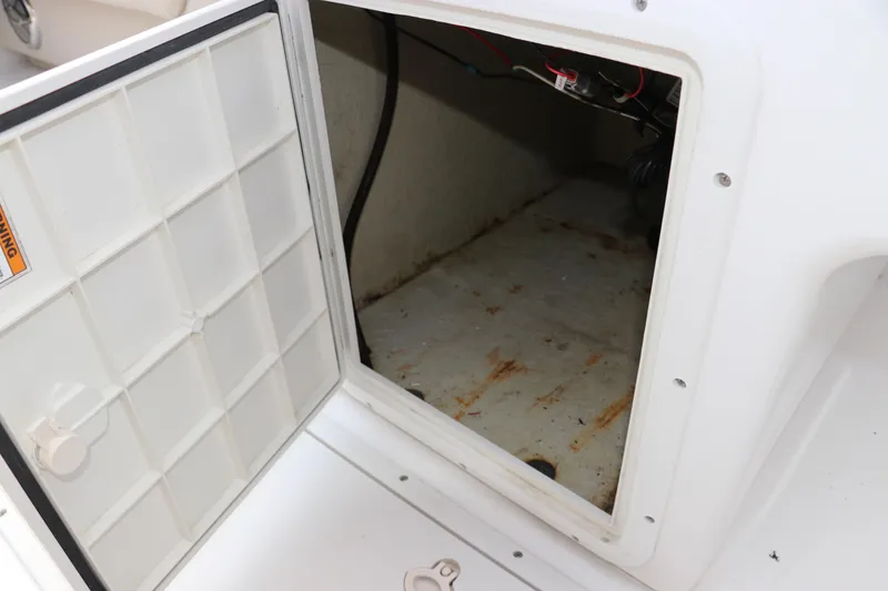 Slide: The Image of Open storage compartment on 2014 Hurricane FunDeck 226 boat, showing interior space. - 20