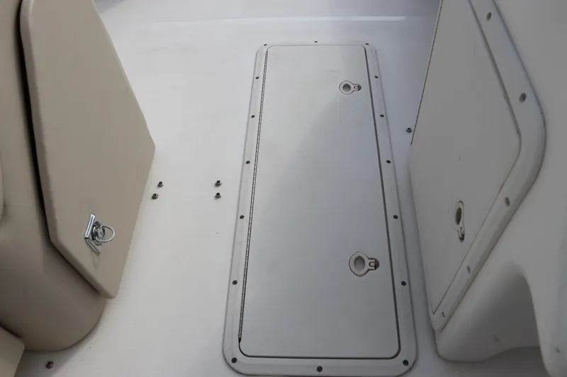 Slide: The Image of 2014 Hurricane FunDeck 226 boat deck with storage compartments and beige seating. - 21