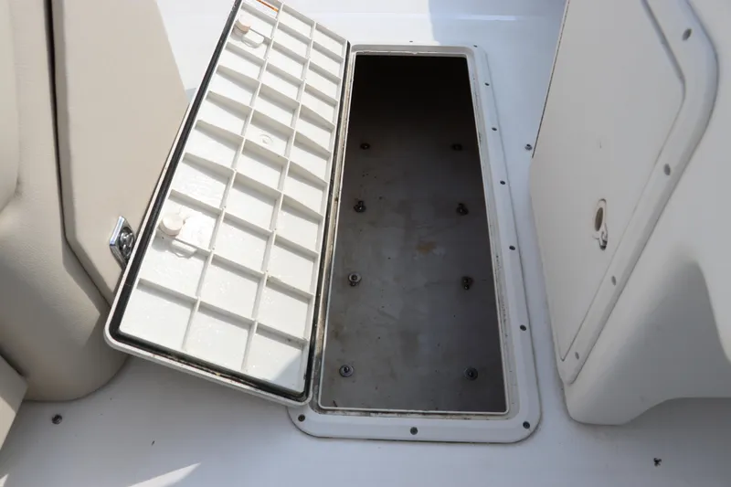 Slide: The Image of Open storage compartment on 2014 Hurricane FunDeck 226 boat. - 22