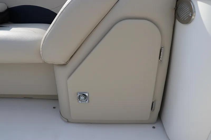 Slide: The Image of 2014 Hurricane FunDeck 226 boat interior storage compartment with beige upholstery. - 26