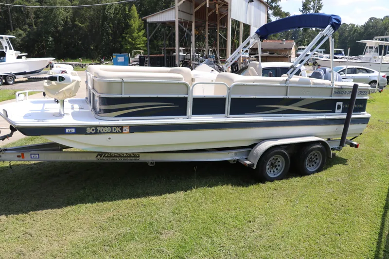 Slide: The Image of 2014 Hurricane FunDeck 226 pontoon boat on trailer, parked on grass. - 3
