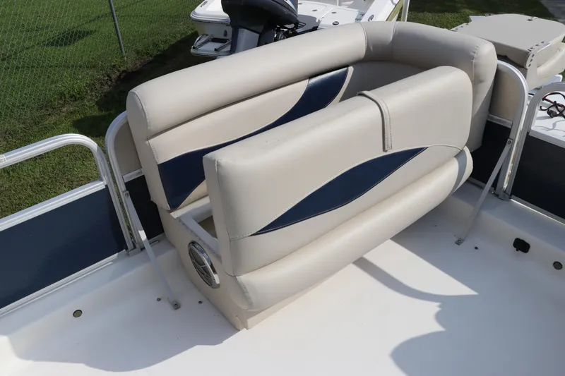 Slide: The Image of 2014 Hurricane FunDeck 226 boat seating with blue and beige upholstery. - 31
