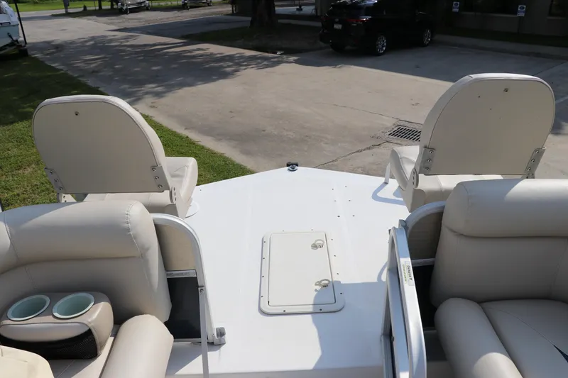 Slide: The Image of 2014 Hurricane FunDeck 226 boat interior with white seating and cup holders. - 34