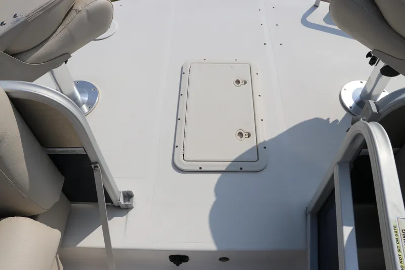 Slide: The Image of 2014 Hurricane FunDeck 226 boat interior with seating and storage hatch. - 38