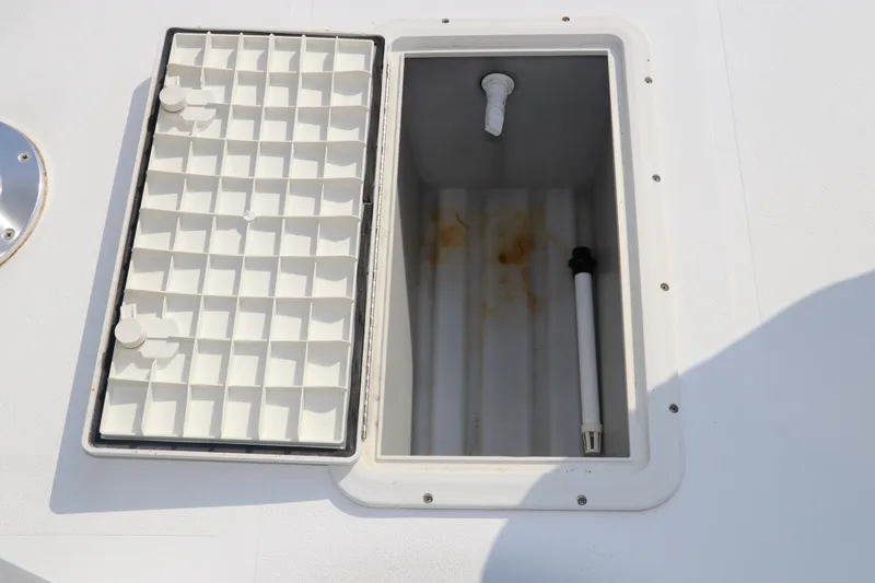 Slide: The Image of Open storage compartment on 2014 Hurricane FunDeck 226 boat deck. - 39