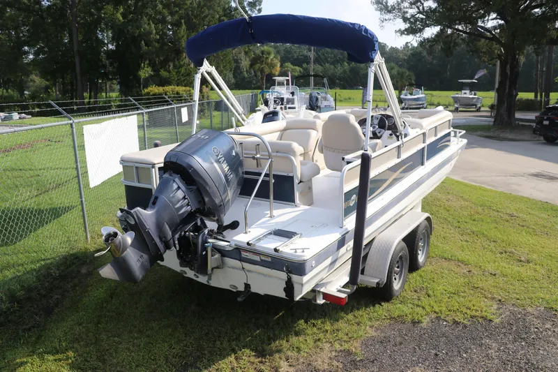 Slide: The Image of 2014 Hurricane FunDeck 226 boat on trailer with Yamaha outboard motor. - 4
