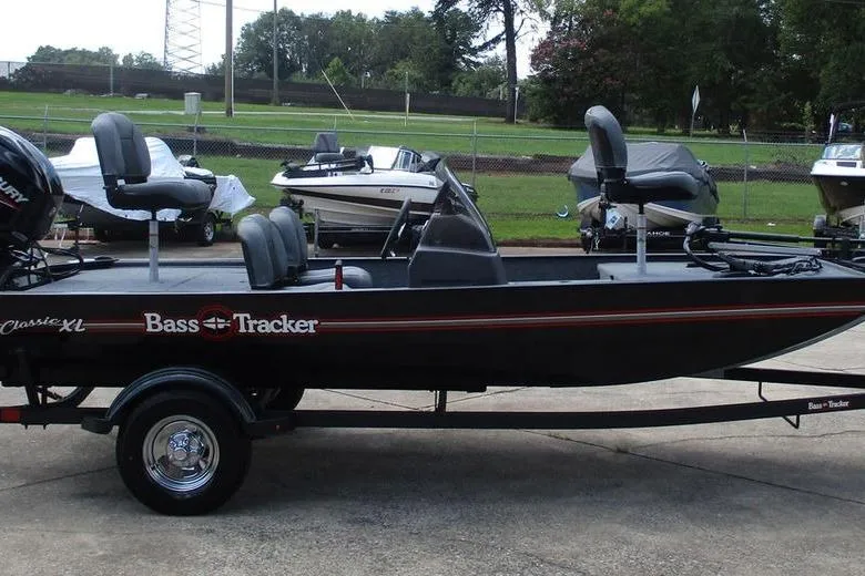 Slide: The Image of 2026 Tracker BASS TRACKER® Classic XL boat on trailer, parked outdoors. - 3