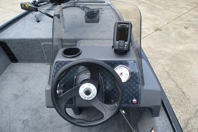 Slide: The Image of 2026 Tracker BASS TRACKER® Classic XL boat dashboard with steering wheel and navigation system. - 4