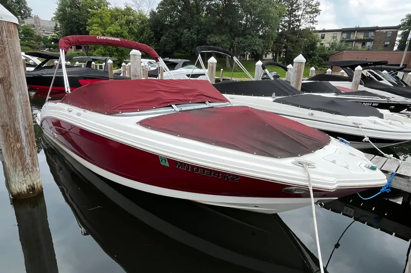 Slide: The Image of 2013 Chaparral 226 SSi Wide Tech boat docked with red cover. - 0