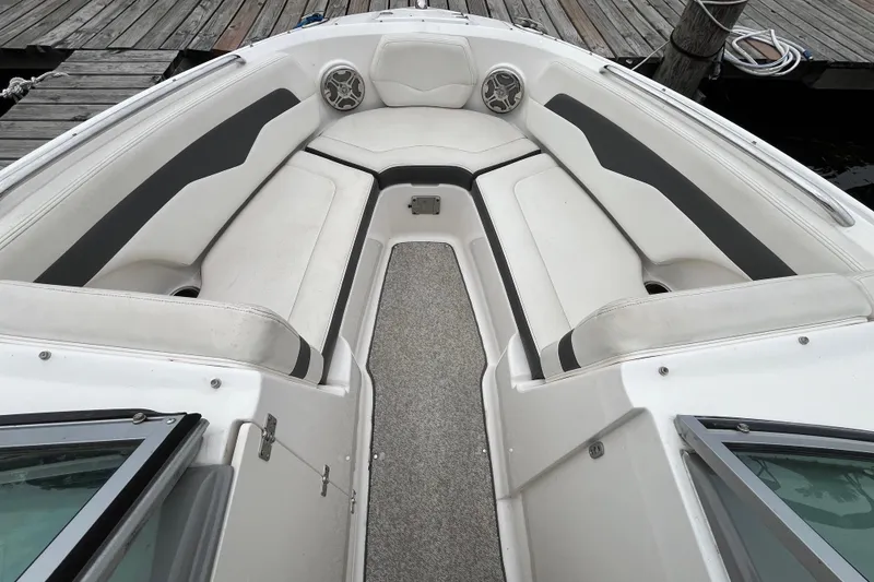Slide: The Image of 2013 Chaparral 226 SSi Wide Tech boat interior with white seating and gray accents. - 18