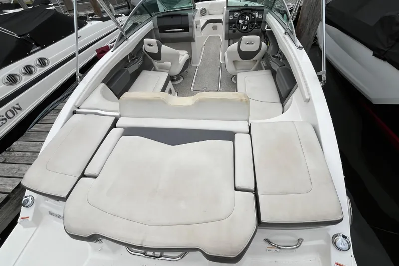 Slide: The Image of 2013 Chaparral 226 SSi Wide Tech boat interior with spacious seating and modern design. - 4