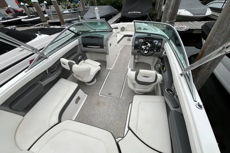 Slide: The Image of 2013 Chaparral 226 SSi Wide Tech boat interior with seating and steering wheel. - 6