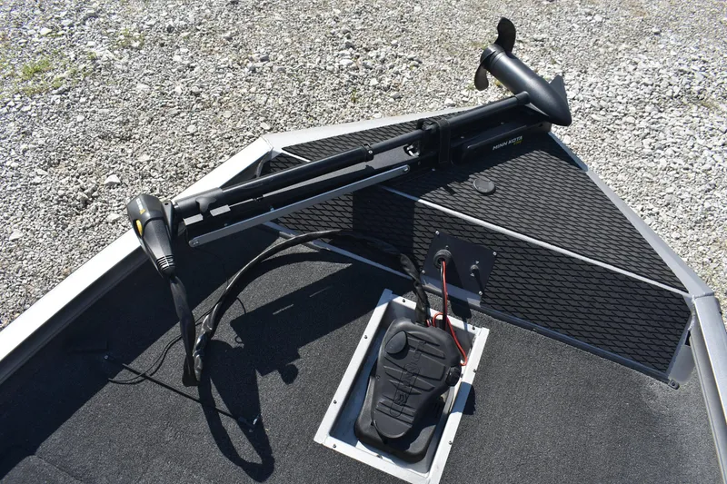 Slide: The Image of 2015 Lowe Stinger 175 boat with trolling motor on gravel surface. - 10