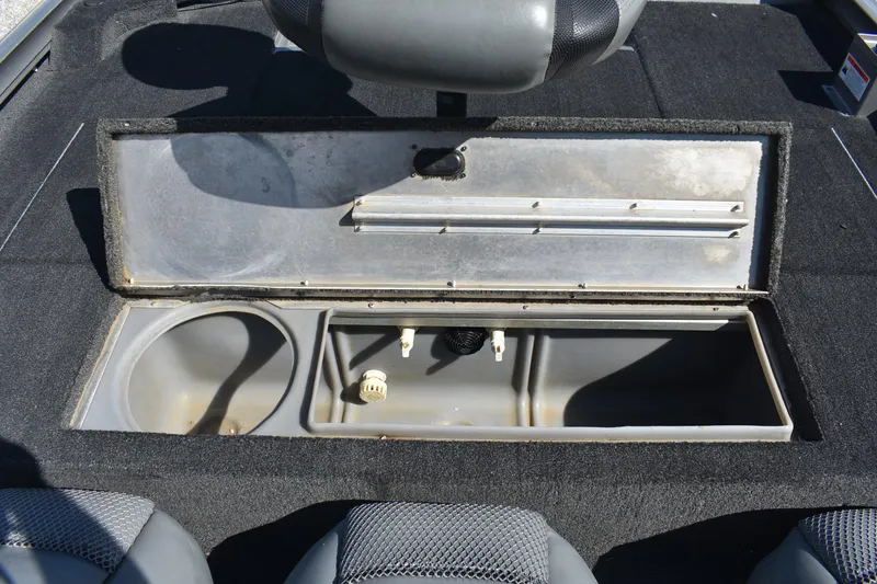 Slide: The Image of 2015 Lowe Stinger 175 boat storage compartment with open lid, showcasing interior space. - 12