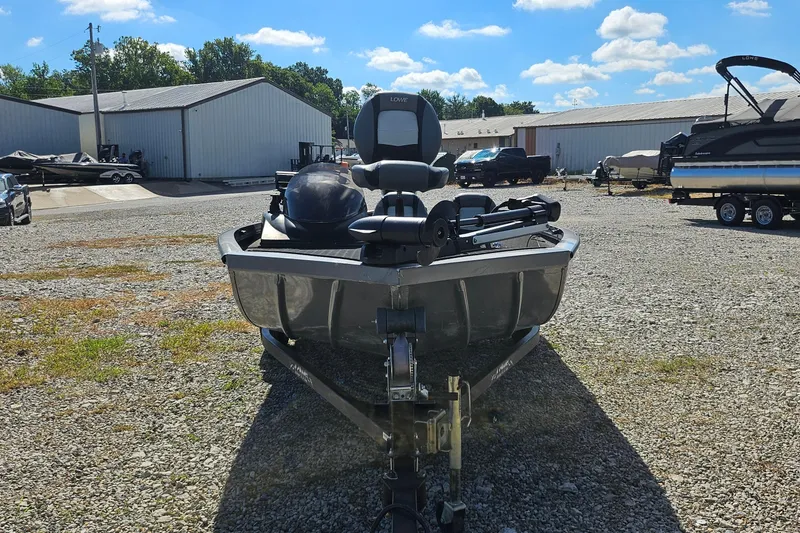 Slide: The Image of 2015 Lowe Stinger 175 boat on trailer in outdoor storage area. - 3