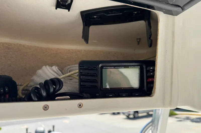 Slide: The Image of Standard Horizon Explorer radio in 2012 Sea Hunt Triton 225 boat console. - 16