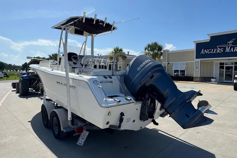 Slide: The Image of 2012 Sea Hunt Triton 225 boat with Yamaha engine at Anglers Marine dealership. - 2