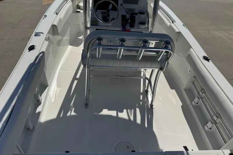 Slide: The Image of 2012 Sea Hunt Triton 225 boat interior with steering console and seating. - 20