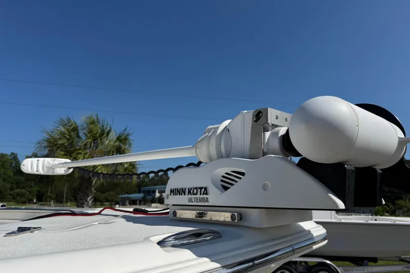 Slide: The Image of Minn Kota Ulterra motor on 2012 Sea Hunt Triton 225 boat under clear blue sky. - 21