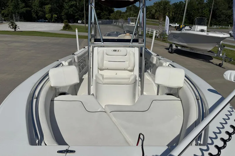 Slide: The Image of 2012 Sea Hunt Triton 225 boat with spacious seating and sleek design. - 22